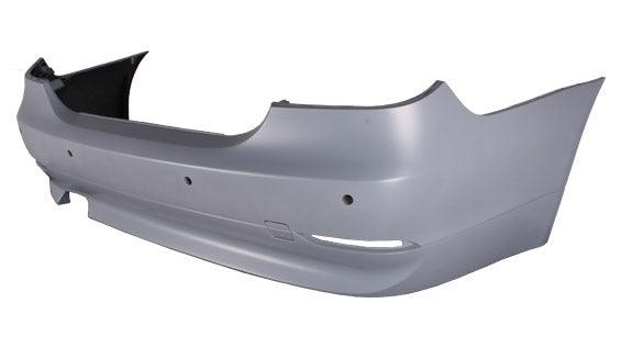 2004-2007 Bmw 5 Series Rear Bumper Primed Gray With Sensor Without M Pkg , BM1100139. Angle view for visual reference.