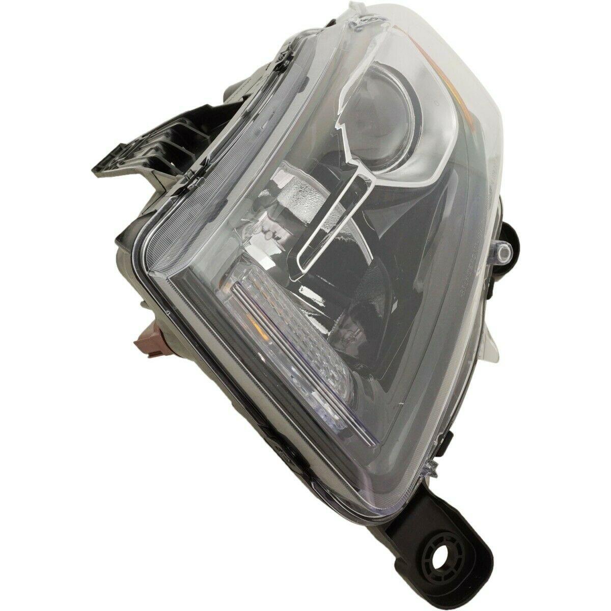 2014-2016 Jeep Grand Cherokee Head Lamp Driver Side Halogen Std Type Black Bezel , CH2502308. Side view of the replacement part.