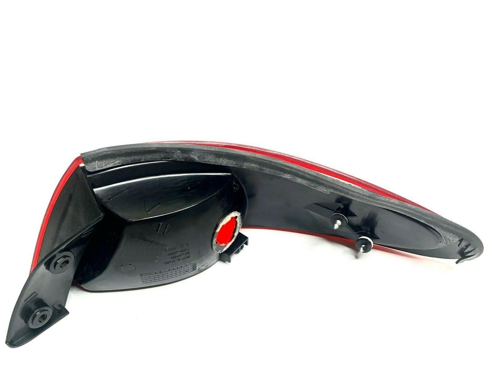 1997-1998 Ford Escort Tail Lamp Passenger Side , FO2801136. Durable and impact-resistant.