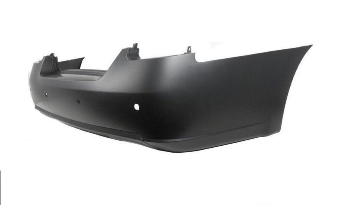 2007-2008 Nissan Maxima Rear Bumper Primed With Park Assistance , NI1100245. Side view of the replacement part.